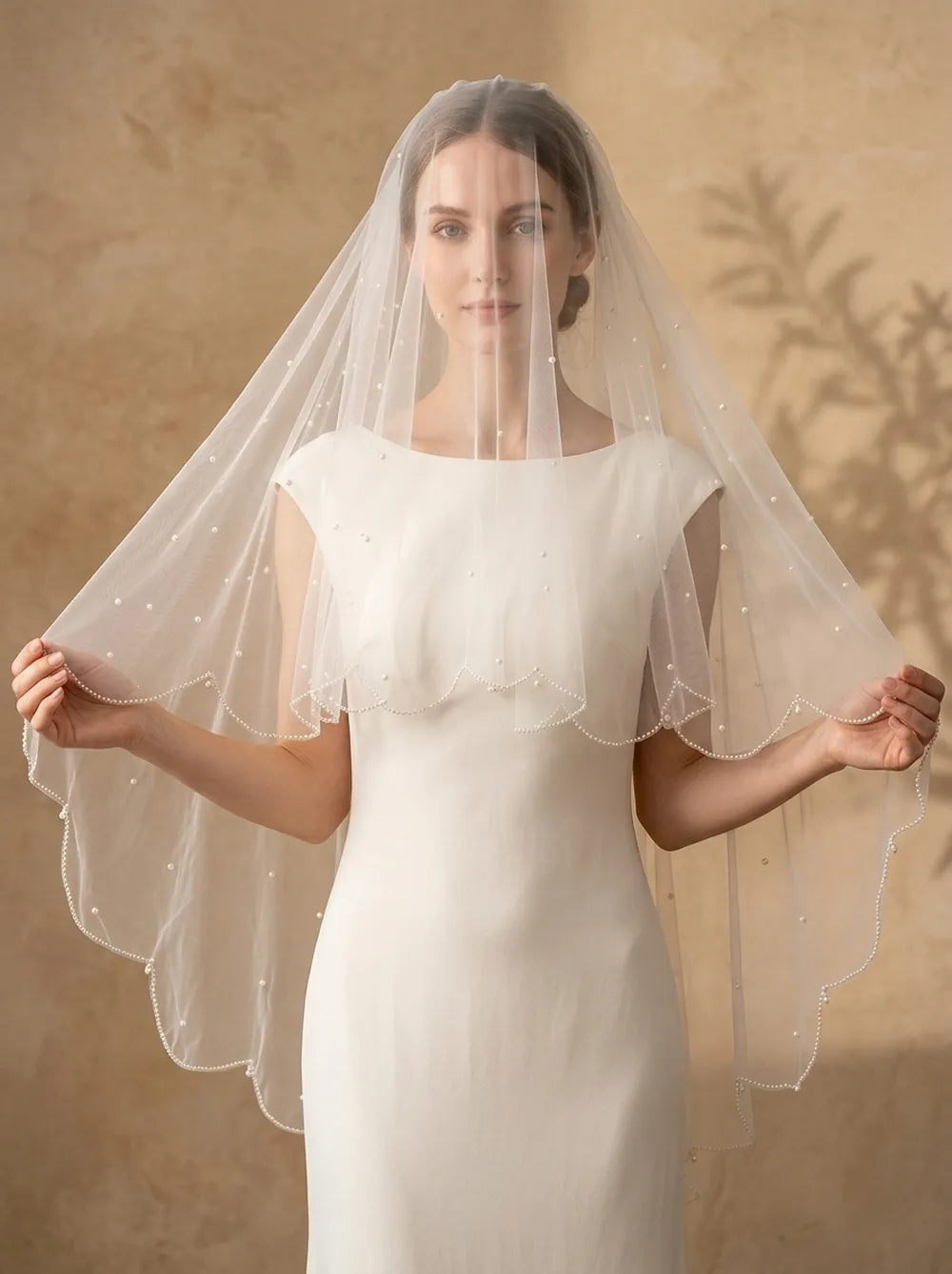 2-tier soft white pearl veil on mannequin showing 70cm top layer and 100cm bottom layer with scalloped crystal drop edge