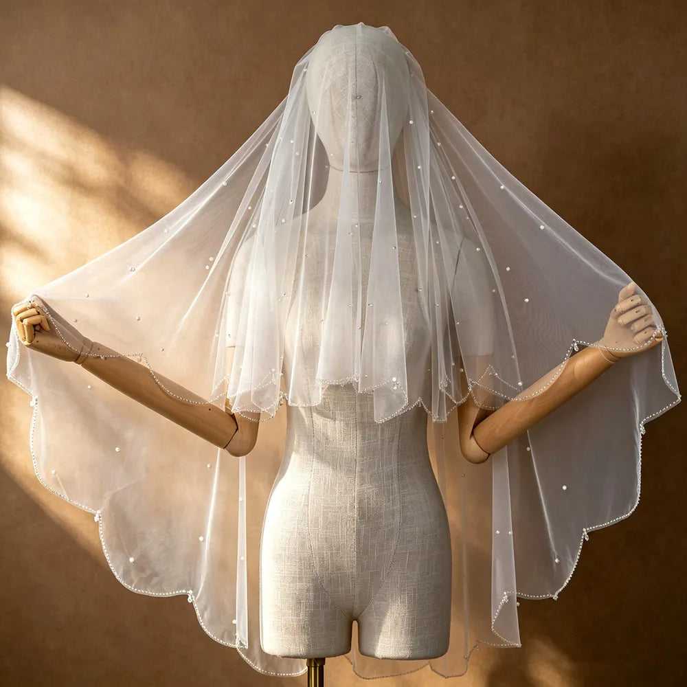 Close-up of overlapping tulle tiers demonstrating romantic depth created by double scalloped borders
