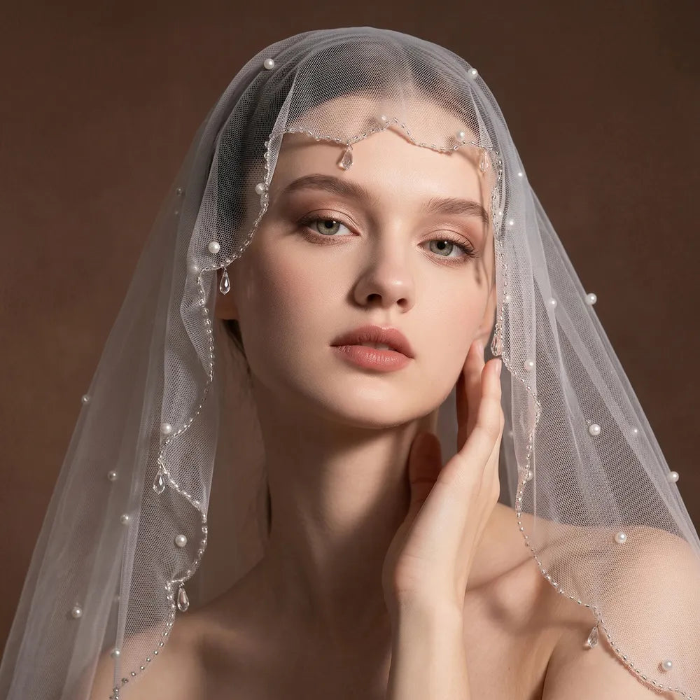 Romantic bridal shot capturing the top 70cm layer lifted back over the head during wedding ceremony