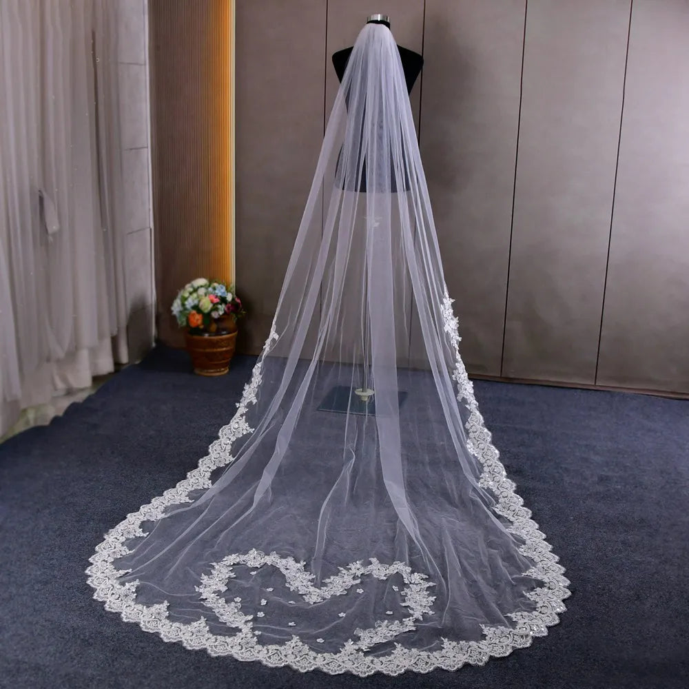 Studio portrait highlighting the heart-shaped lace frame on the train against a sleek dark studio floor