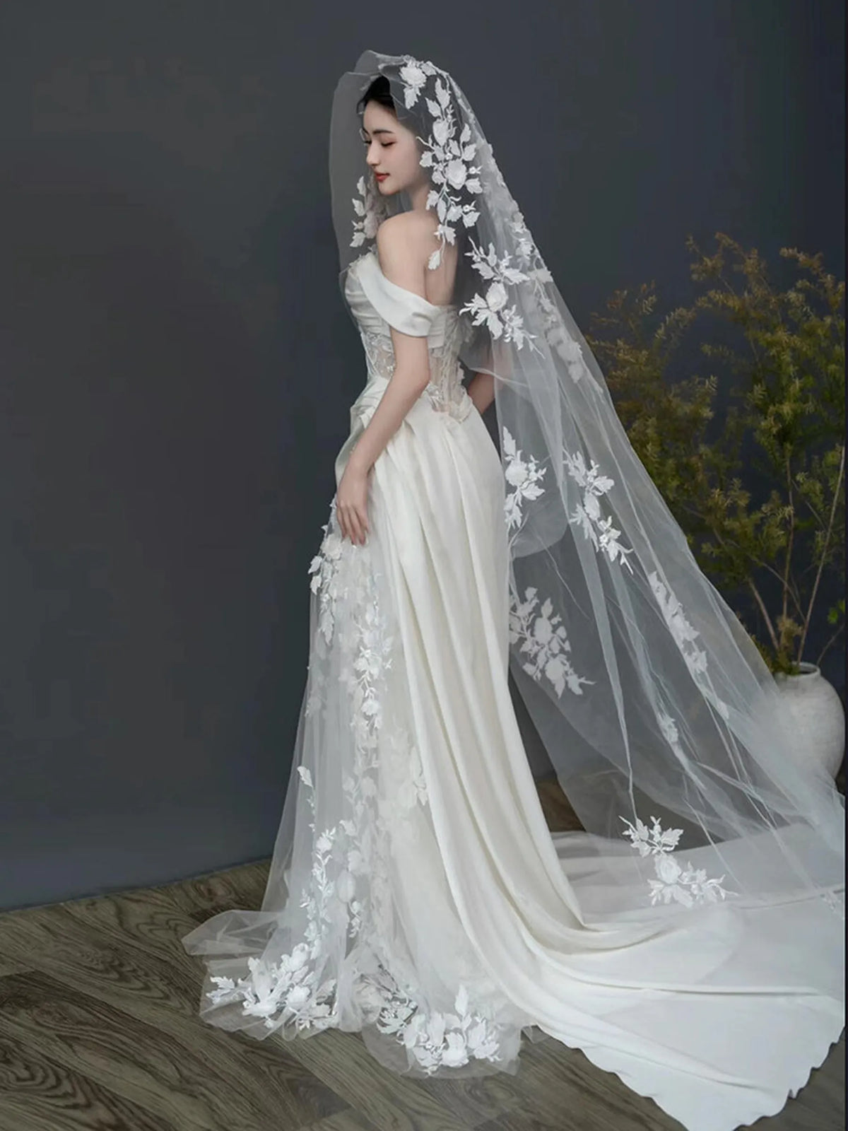 bride wearing romantic floral lace cathedral veil