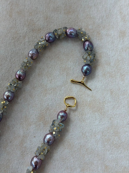 Close-up view of 18K gold-plated S925 OT toggle clasp on moonstone pearl necklace.