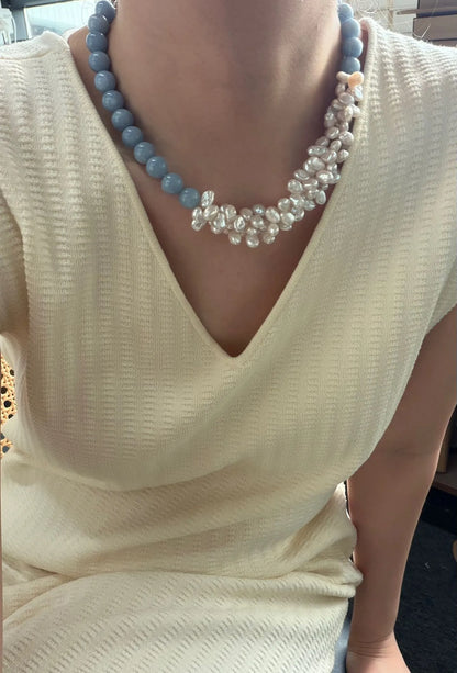 Model wearing the 43cm soft blue angelite and clustered white pearl necklace with a V-neck sweater.
