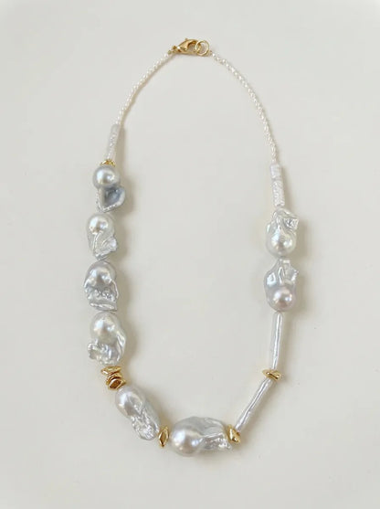 45cm barn-style baroque freshwater pearl necklace with brass gold accents and 18k gold plated clasp on white background.