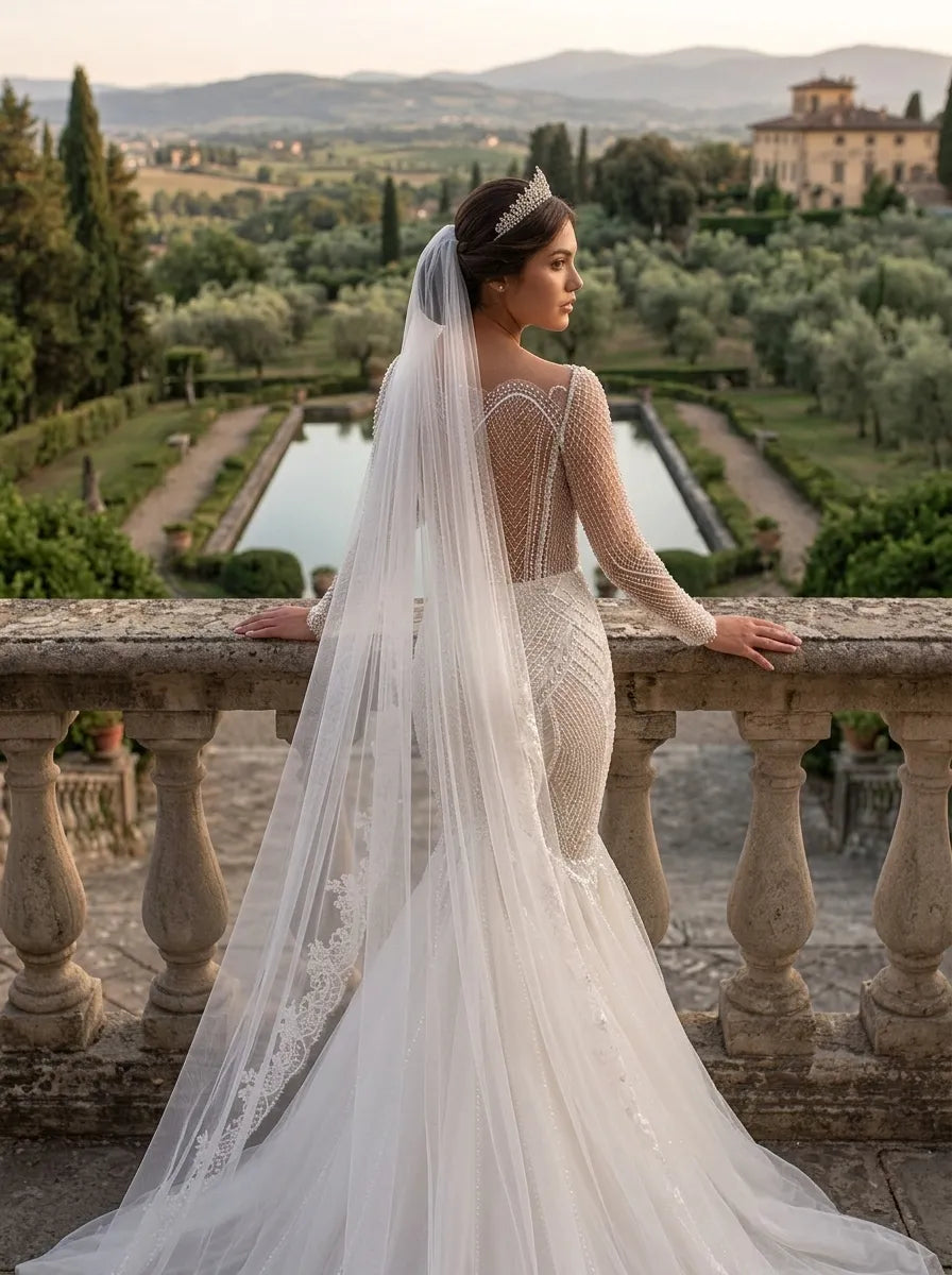 Close-up rear angle of bride displaying the detailed floral lace edge framing her upper back and arms