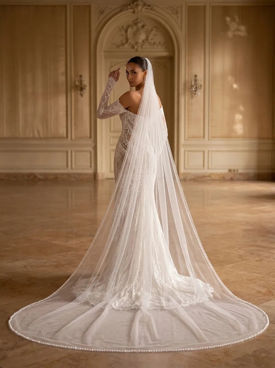 Single-tier cathedral bridal veil (300cm/118.11in) with shimmering sequin and pearl beaded edge, draped gracefully on a mannequin showing wide curved train