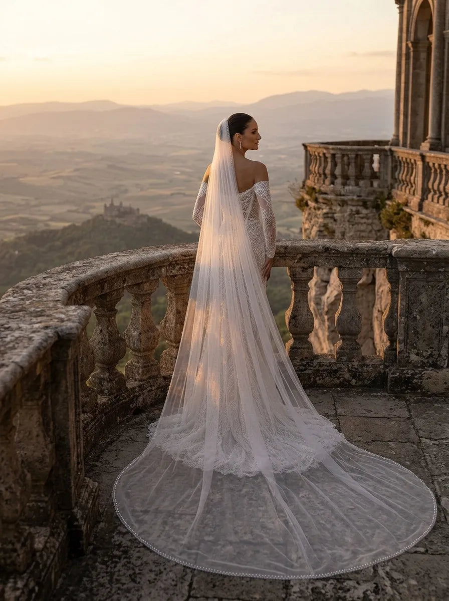 Over-the-shoulder view of bride displaying the continuous sequin pearl trim framing her silhouette and lower back