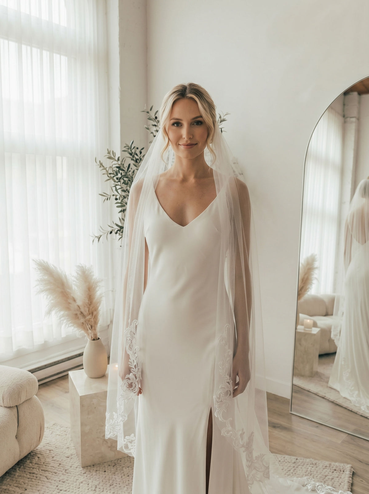 Bride wearing vintage lace border long trail sheer cathedral bridal wedding veil