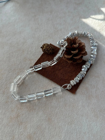 Detailed view of faceted clear crystal prism beads and S925 silver clasp stamp.