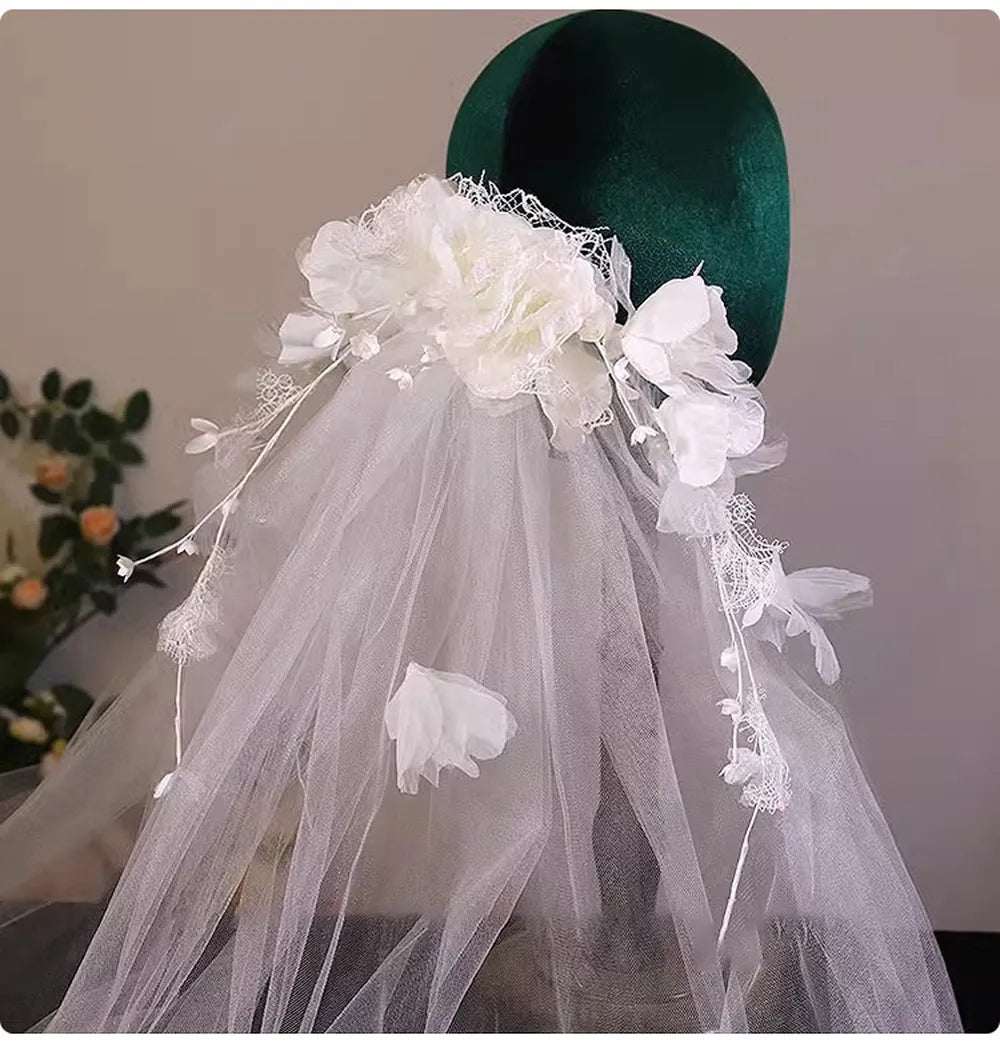 Front view of a flower crown wedding veil with cascading floral vines framing the face