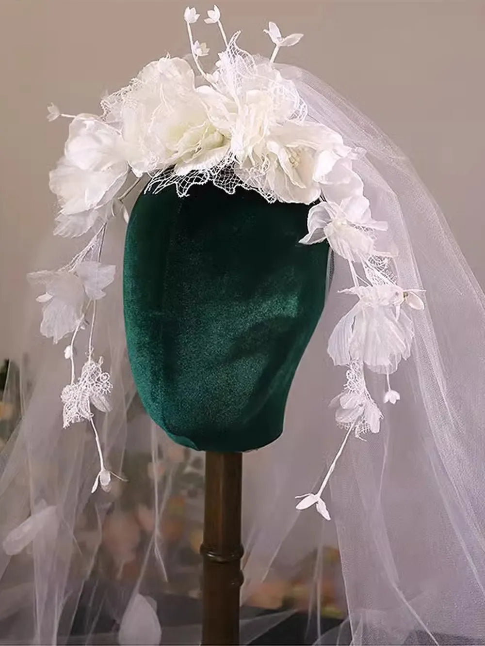 Front view of a flower crown wedding veil with cascading floral vines framing the face