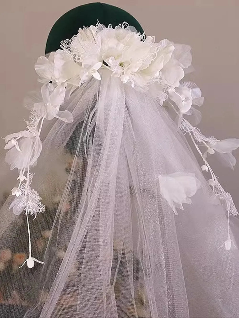 Side view of romantic 3D floral halo bridal veil on a display mannequin