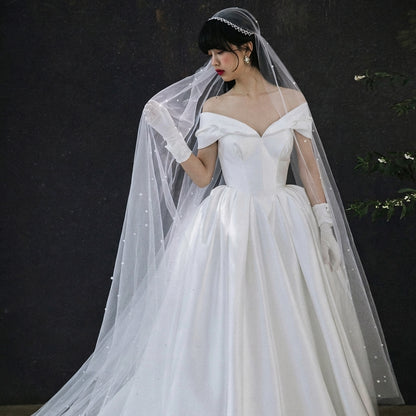 long tulle wedding veil with delicate scattered details