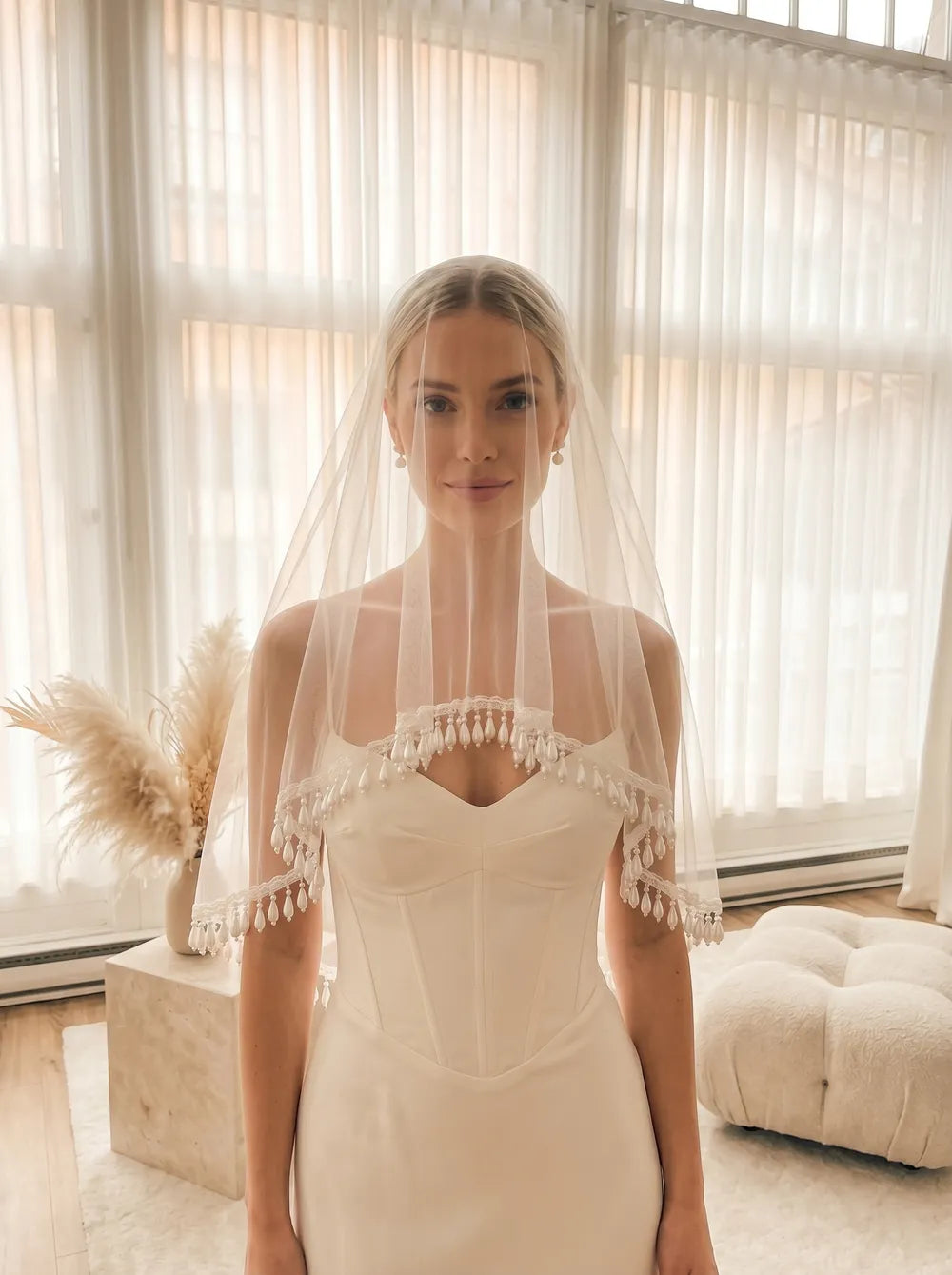 Comb-free circle drop veil with teardrop pearl border displayed over a mannequin head