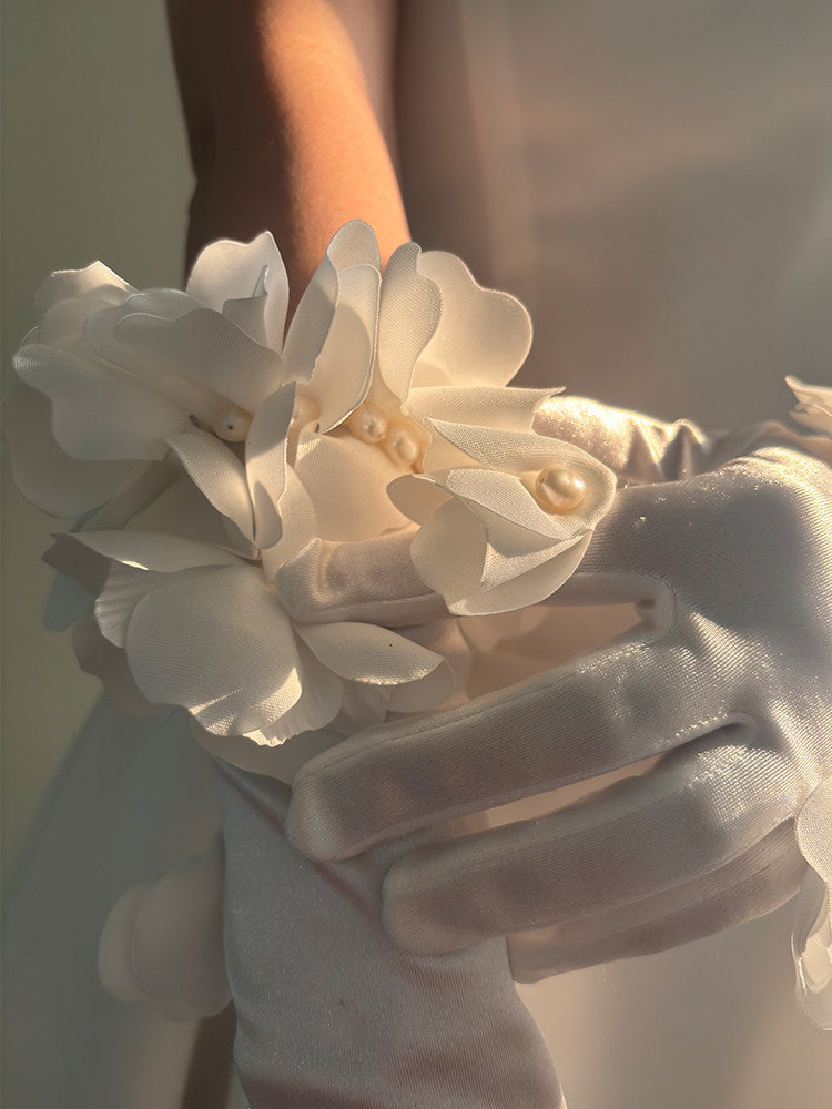 French romantic long ivory satin opera gloves with handcrafted 3D organza floral clusters and pearl petal embellishments for bridal wear.