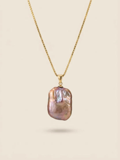 Vertical display of iridescent square baroque pearl pendant on 18K gold-plated box chain