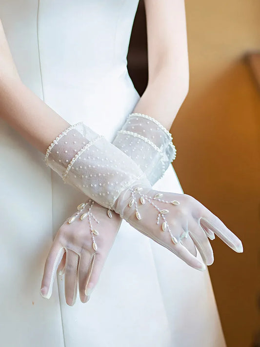 Ivory sheer tulle wedding gloves with pearl details and floral appliqué