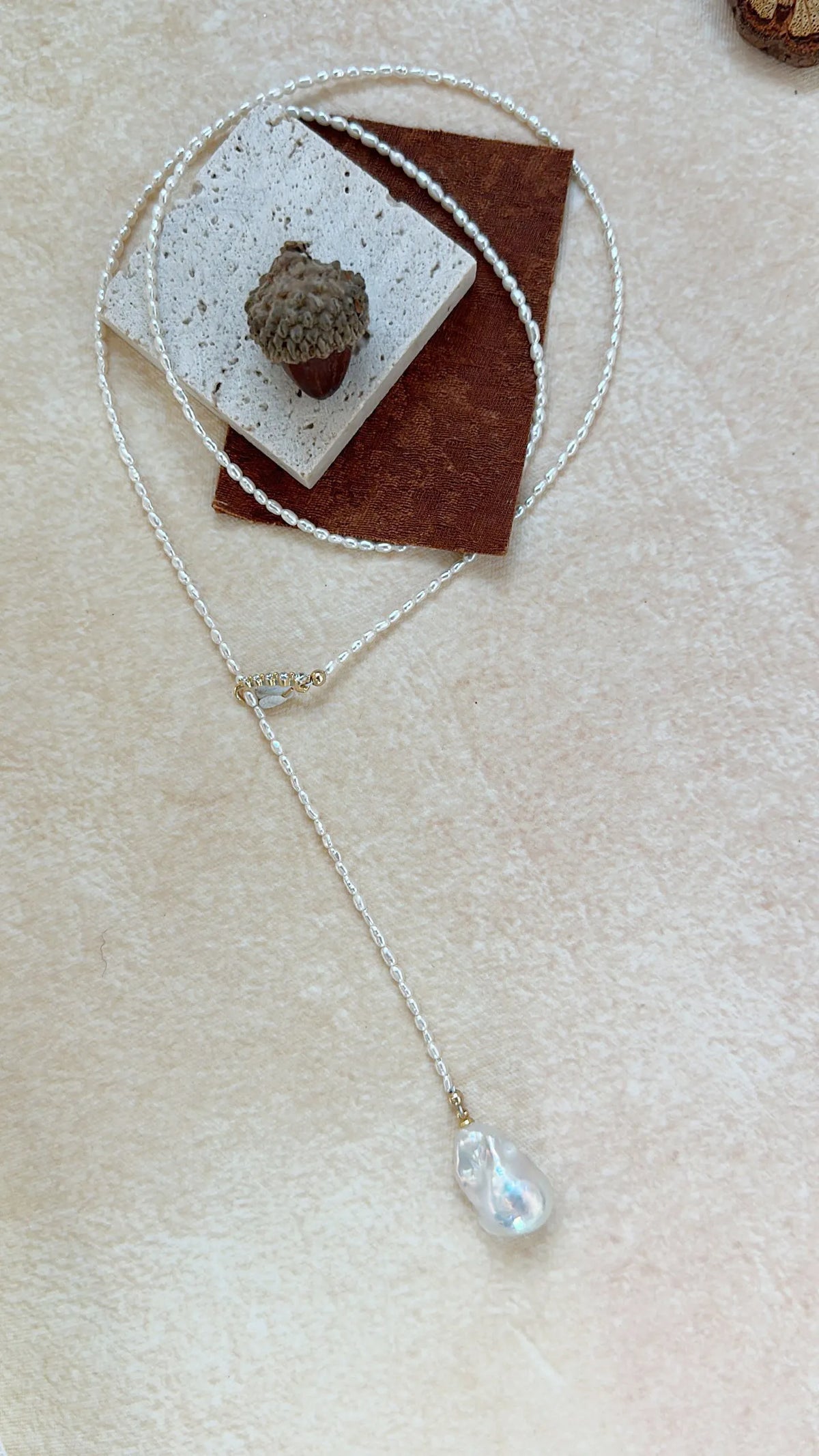 Close-up of the radiant luster and natural texture of the central Keshi baroque pearl drop.