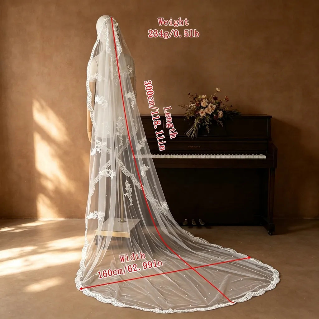 Long cathedral mantilla veil with leafy scalloped lace border trailing down a white sheathSize chart for LUNA-X467 veil showing length 300cm (118.11in), width 160cm (62.99in), weight 234g bridal gown