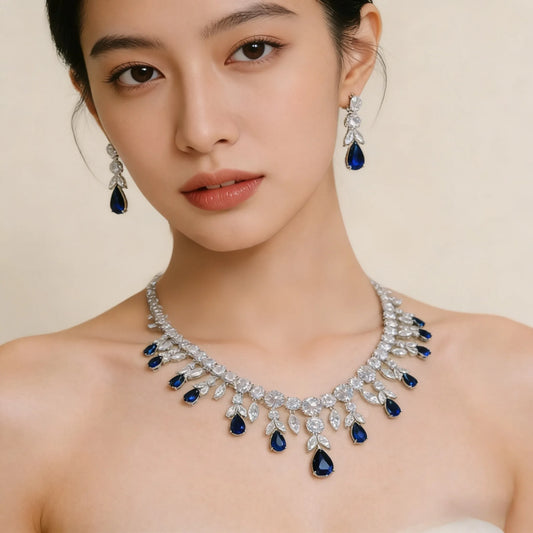 Teardrop statement necklace and earrings set with floral leaf details, elegant bridal jewelry accessories for wedding looks