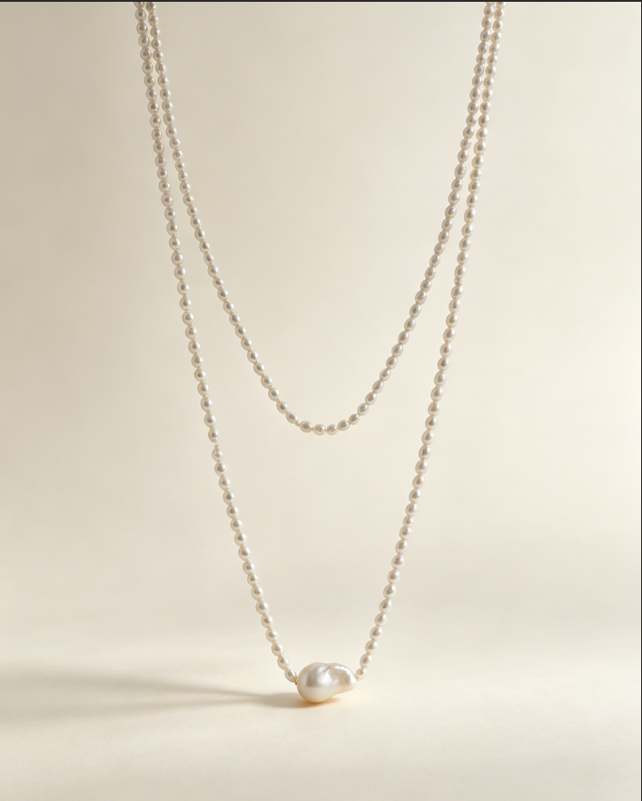 Long freshwater pearl necklace with an irregular baroque pearl centerpiece