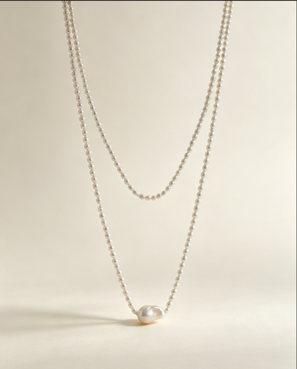 Long freshwater pearl necklace with an irregular baroque pearl centerpiece