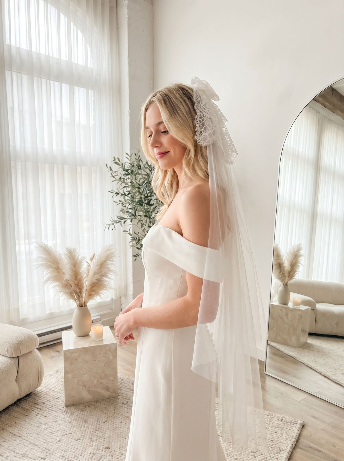 Bride wearing a short white bow veil for bachelorette party