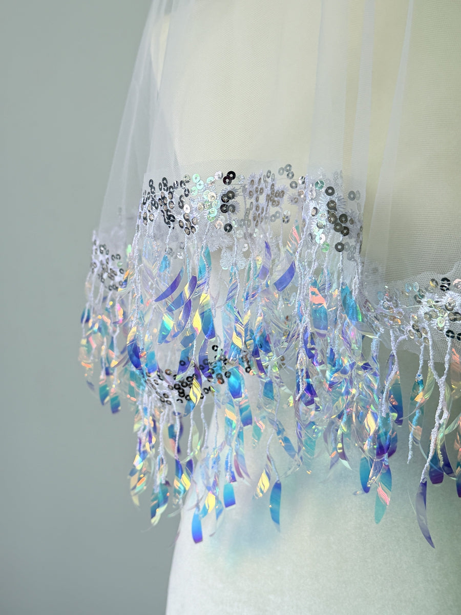 Close up of shimmering sequin tassel details on bridal veil