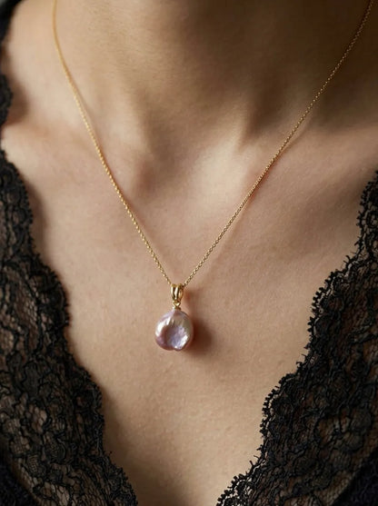 Model wearing the petal baroque pearl necklace on a beaded chain with black lace top.