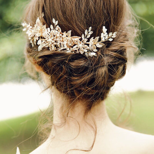 Rose gold floral rhinestone bridal hair comb close‑up, wedding side hairpiece flat lay