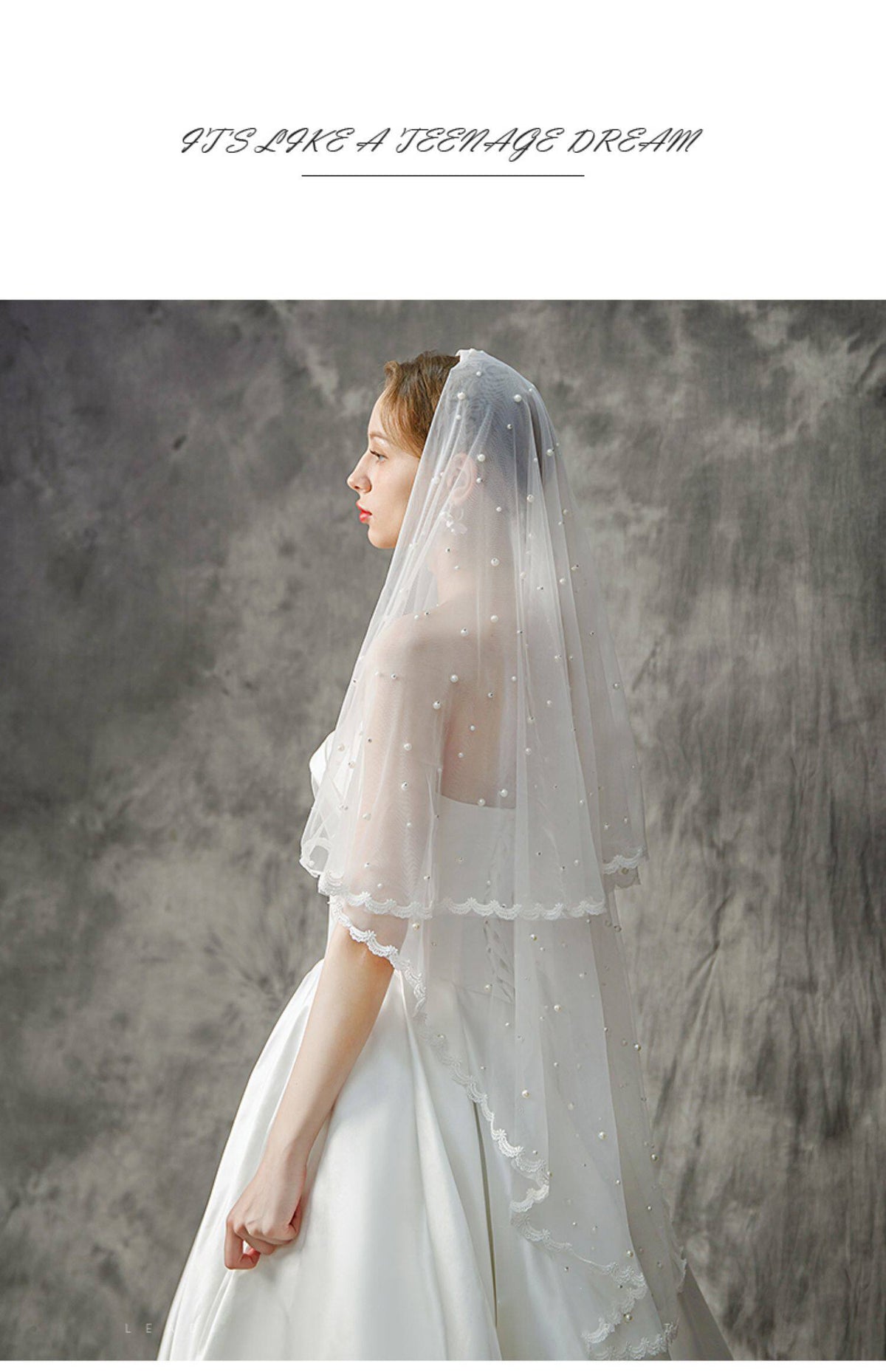 Elegant bride wearing romantic pearl wedding veil