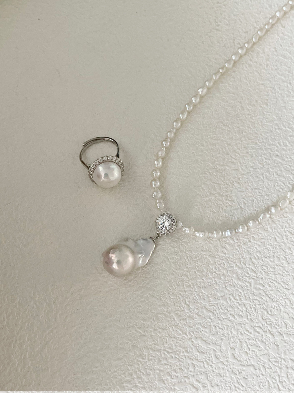 CZ baroque pearl drop necklace on soft neutral backdrop, elegant bridal pearl jewelry