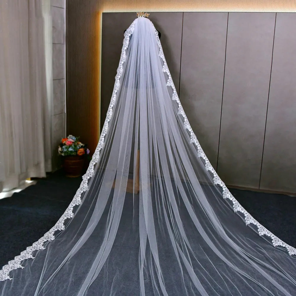 Rear mannequin presentation showing gathered top and full drape of wide sequin floral lace veil