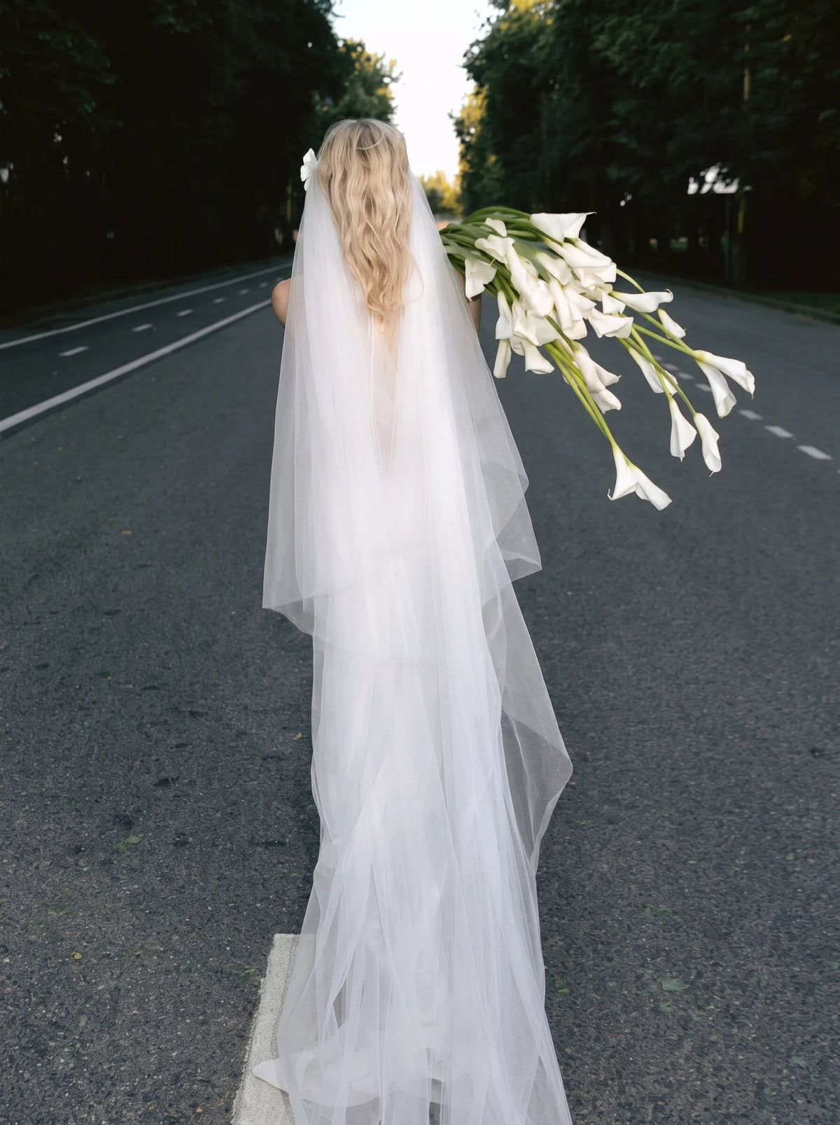 Modern minimalist single-tier cathedral length bridal veil made of high-density soft tulle, attached with handcrafted 3D white satin flower alligator clips.