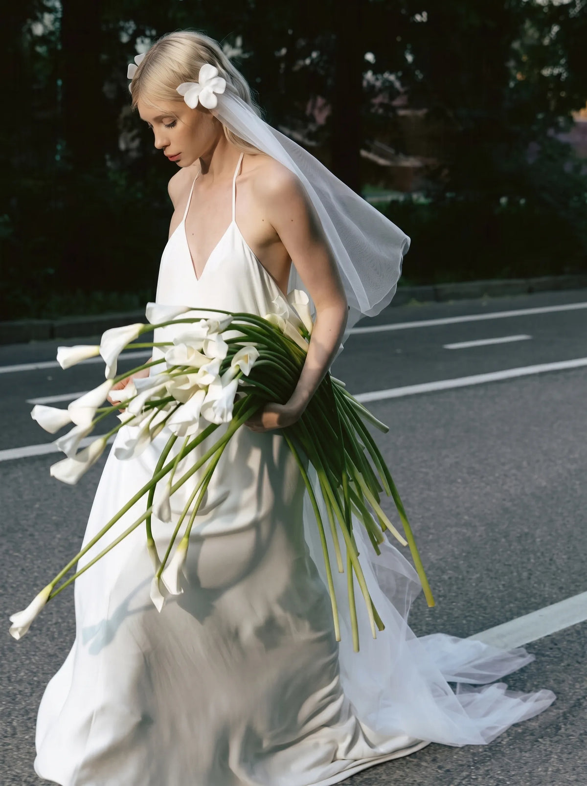 Modern minimalist single-tier cathedral length bridal veil made of high-density soft tulle, attached with handcrafted 3D white satin flower alligator clips.