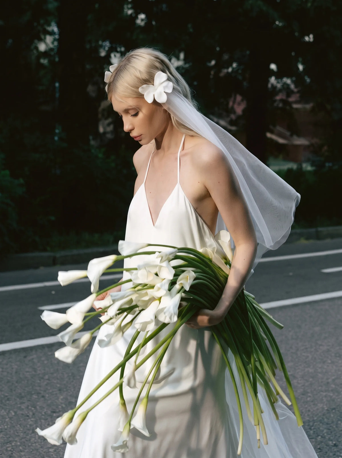 Modern minimalist single-tier cathedral length bridal veil made of high-density soft tulle, attached with handcrafted 3D white satin flower alligator clips.