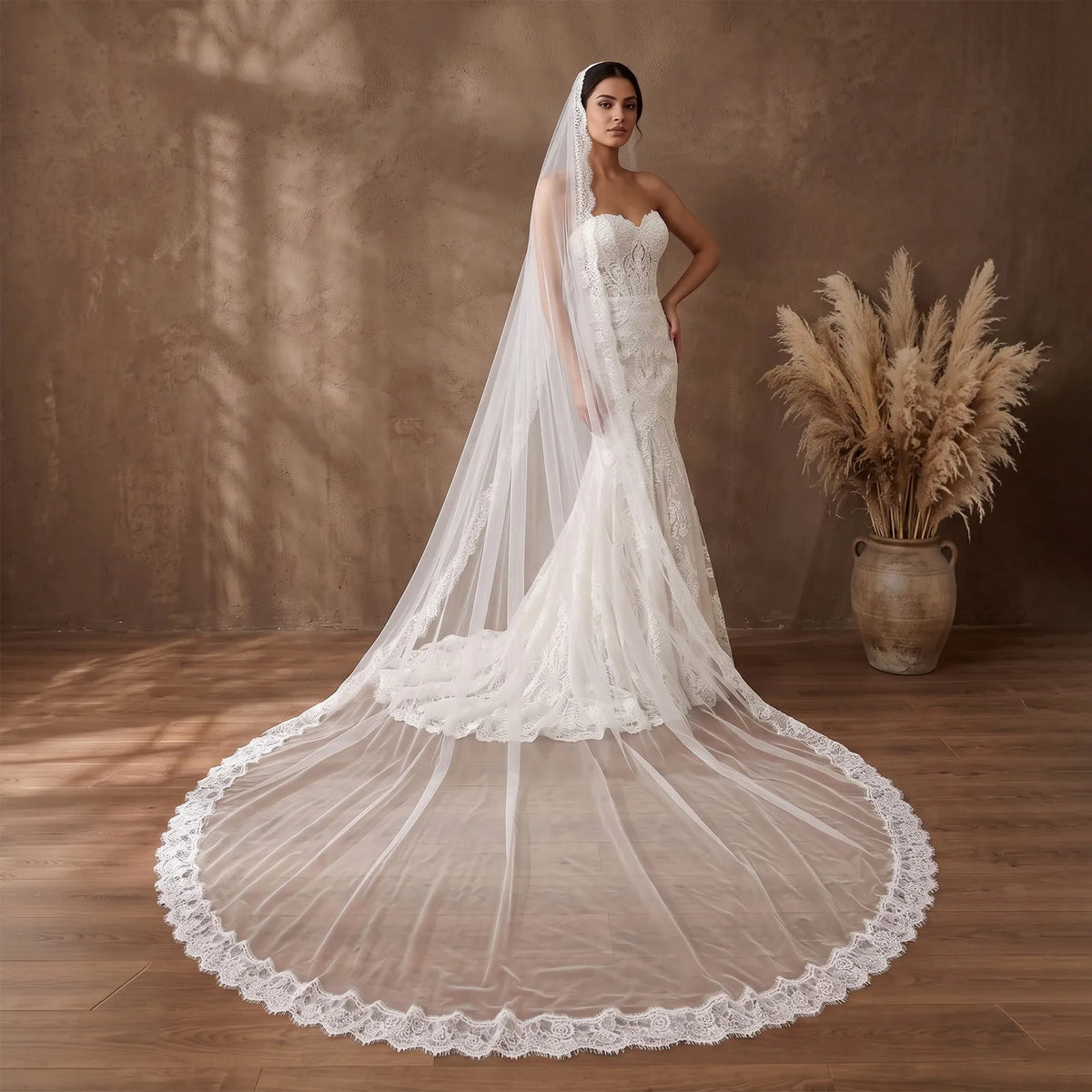 Close-up side portrait of bride with wavy hair framed by sheer white veil mesh and delicate floral eyelash lace trim along the face