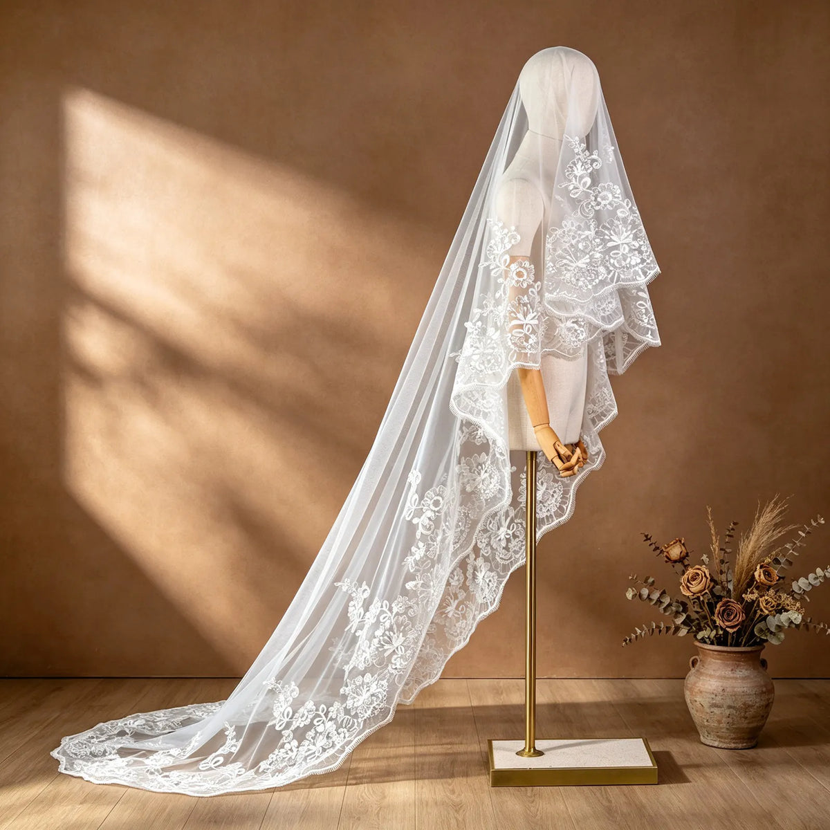 Side profile view of a single-tier cathedral wedding veil with blusher and sequin lace on dress mannequin