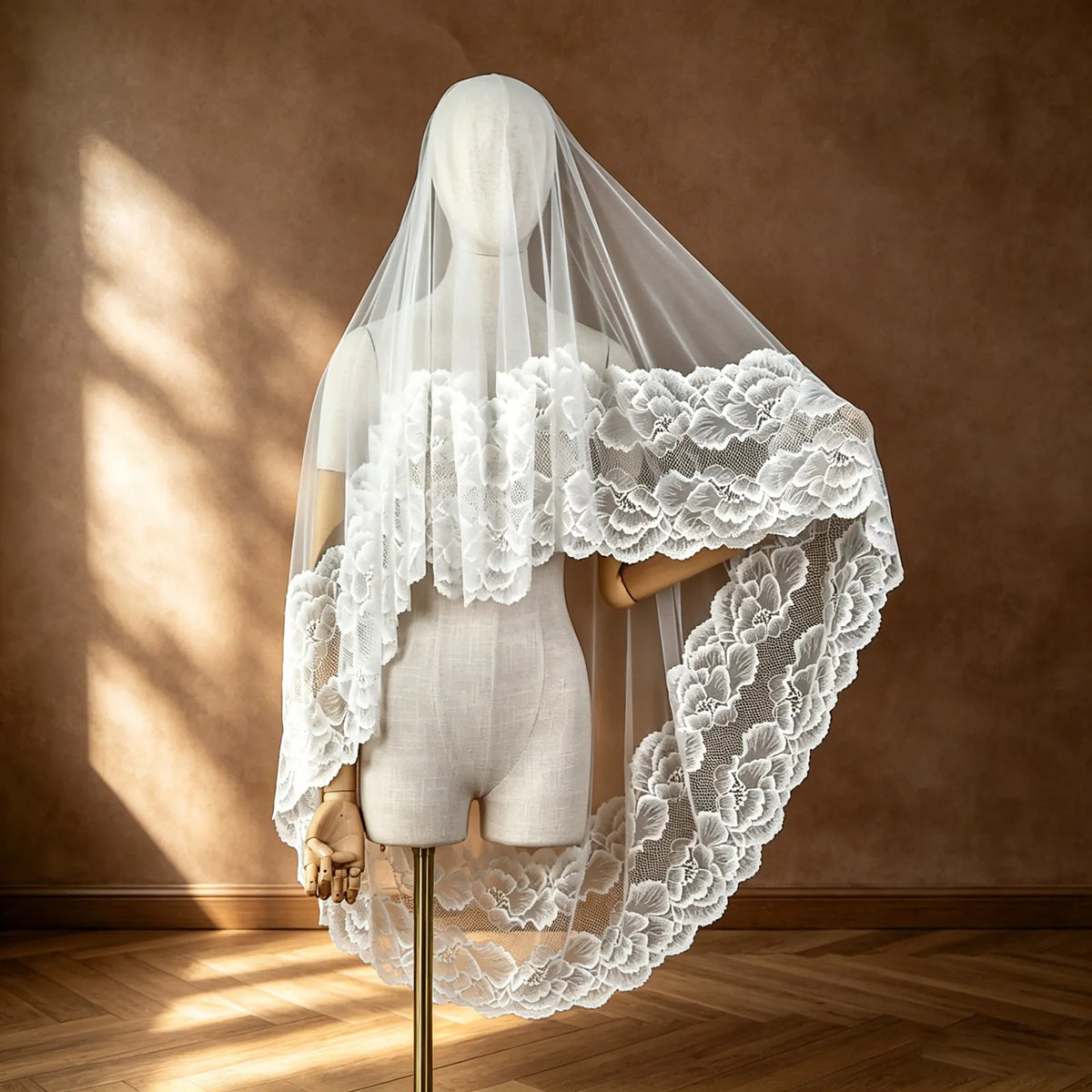 Front view of 150cm single-tier veil with face blusher and wide floral lace trim on dress mannequin