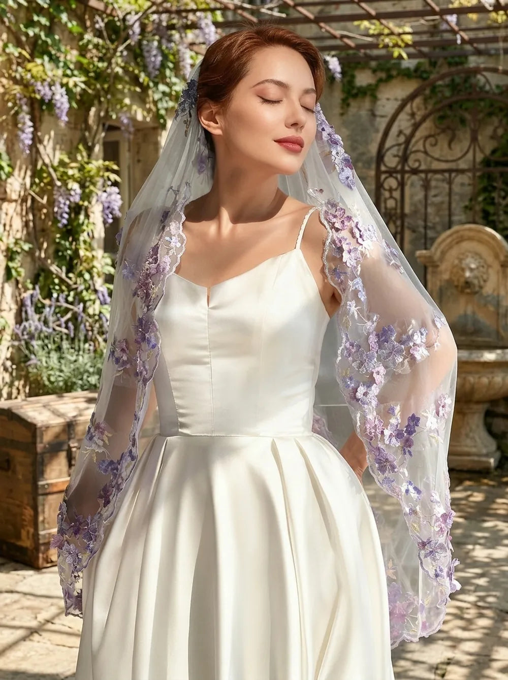 Romantic front portrait of bride in ivory satin wedding dress with eyes closed, wearing a 100cm single-tier soft white veil adorned with cascading purple 3D floral lace along shoulders