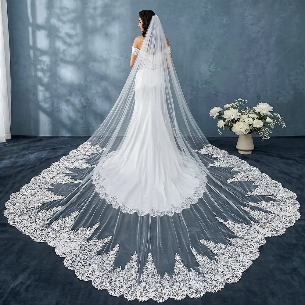 Rear view of bride in fit-and-flare wedding gown with 400cm royal cathedral train flowing smoothly down the aisle