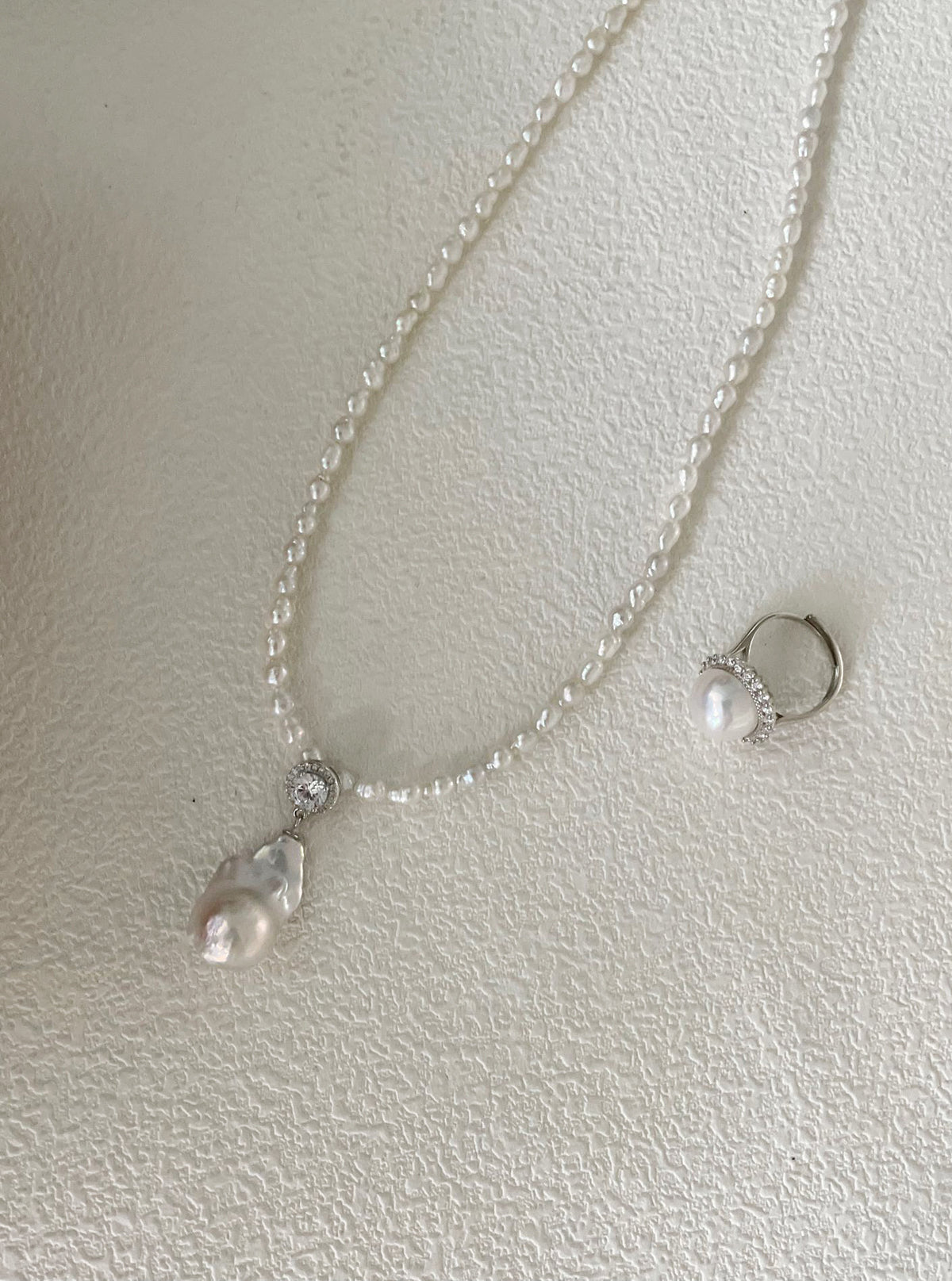 Detail of tiny seed pearl chain and solid sterling silver 5cm adjustable extension chain for pearl pendant necklace