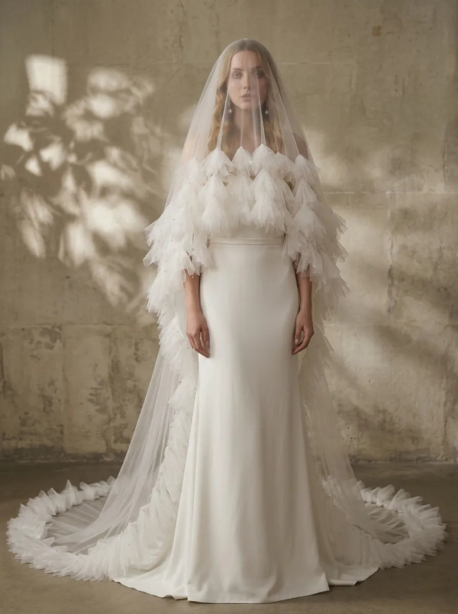 Side view of 300cm ruffle cathedral veil with blusher on dress mannequin under spotlight
