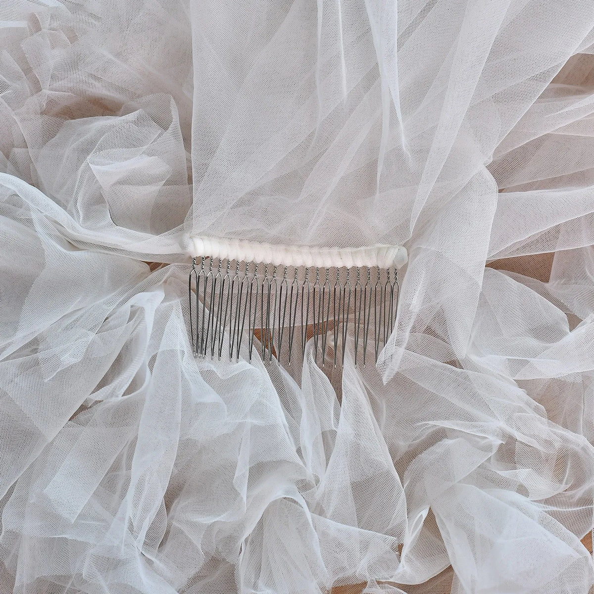 Full view of lace wedding dress with sprawling 300cm ruffled cathedral train on red floor