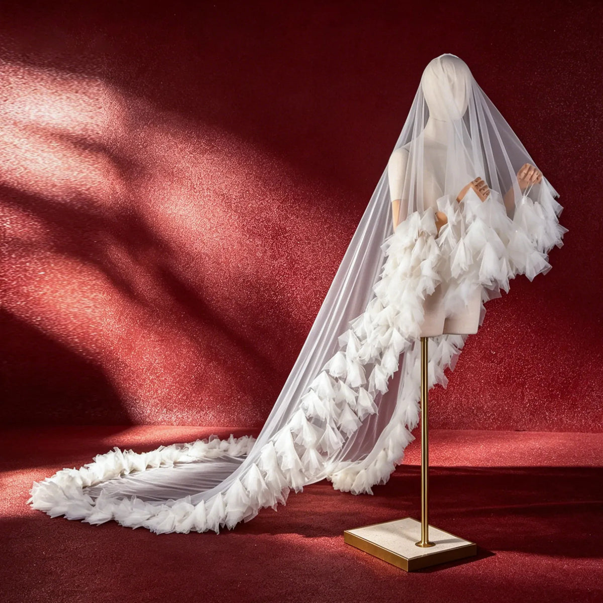 Flat lay close-up of sturdy hand-wrapped metal hair comb attached to soft tulle veil mesh