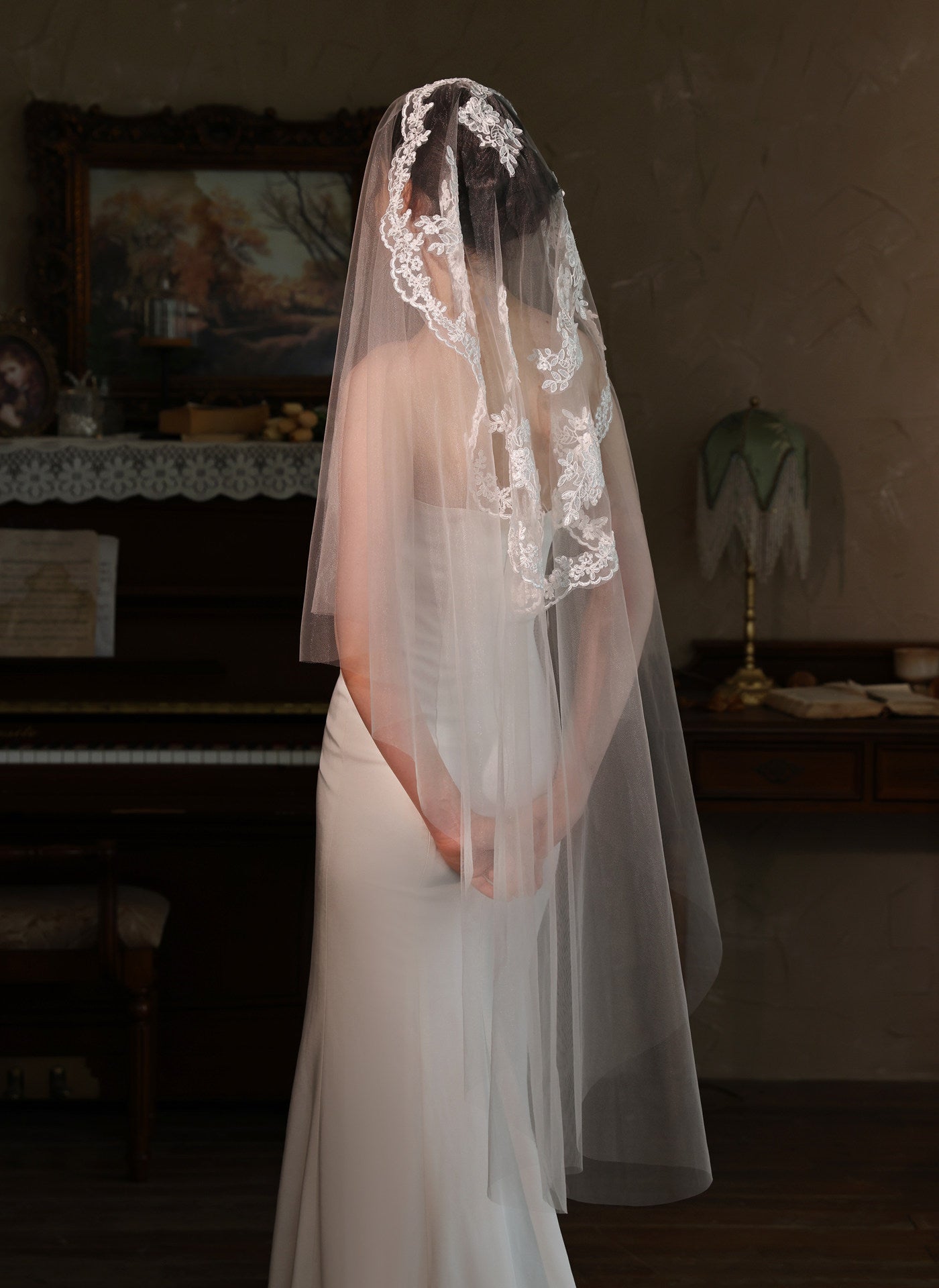 Off-white 2m two tier mid-length bridal veil with hair comb and floral lace applique trim