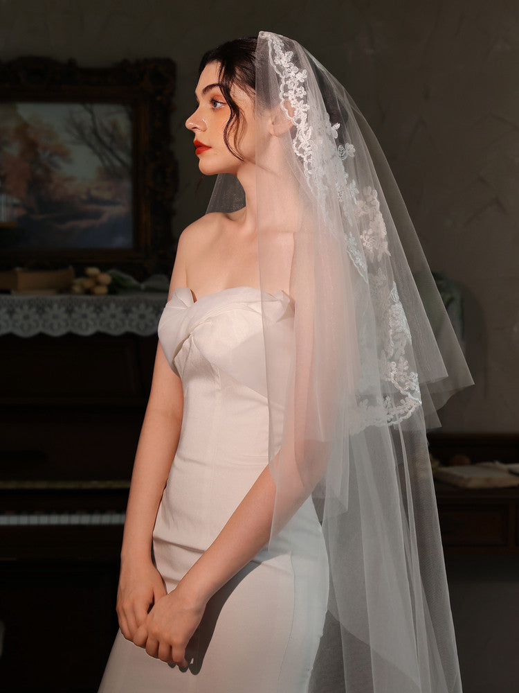 Off-white 2m two tier mid-length bridal veil with hair comb and floral lace applique trim
