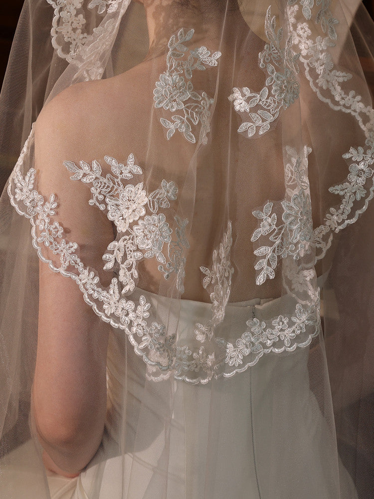 Off-white 2m two tier mid-length bridal veil with hair comb and floral lace applique trim