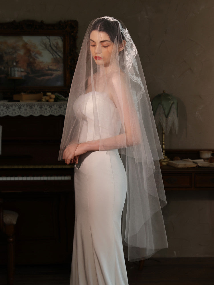 Off-white 2m two tier mid-length bridal veil with hair comb and floral lace applique trim