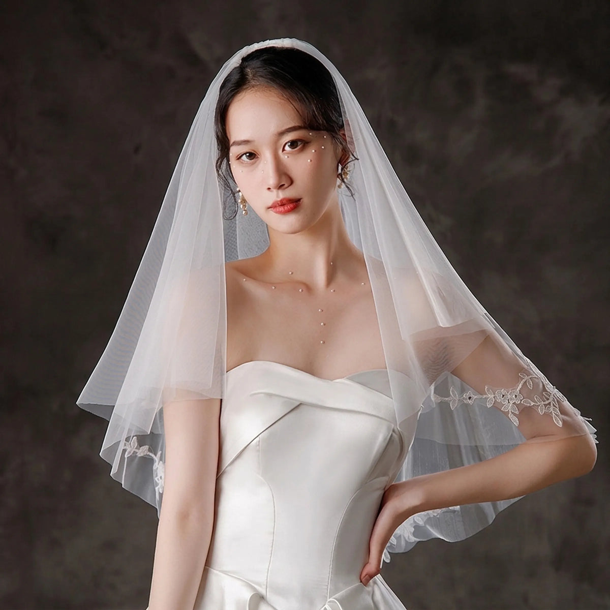 bride wearing a short two tier floral wedding veil